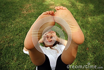 Girl with her feet toether in the air Stock Photo