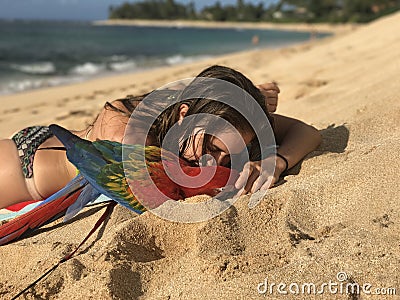 Girl and her Macaw at the beach Stock Photo