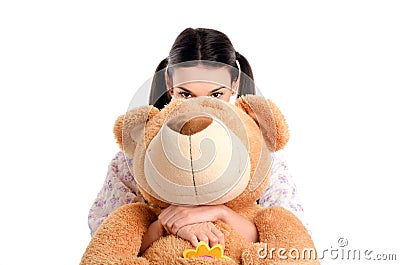 Girl hiding behind the big teddybear. Stock Photo