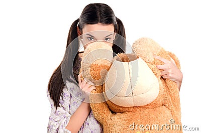 Girl hiding behind the big teddybear. Stock Photo