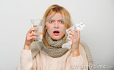 Girl hold glass water tablets and thermometer light background close up. Getting fast relief. Ways to feel better fast Stock Photo