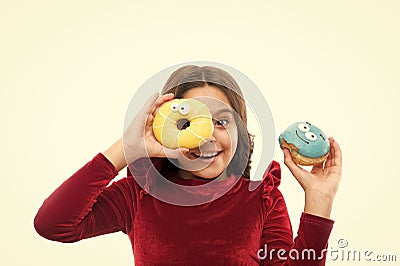 Girl hold sweet donut white background. Child hungry for sweet donut. Sugar levels and healthy nutrition. Nutritionist Stock Photo