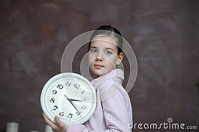 Girl holding big clock Stock Photo