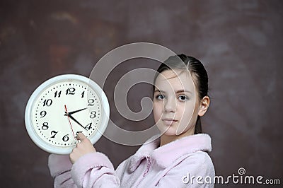 Girl holding big clock Stock Photo