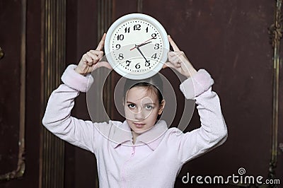 Girl holding big clock Stock Photo