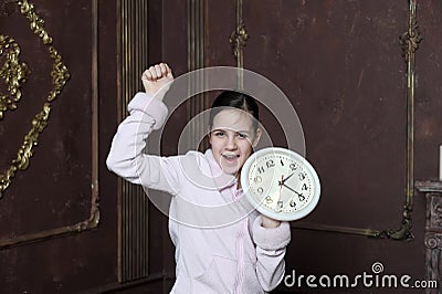 Girl holding big clock Stock Photo