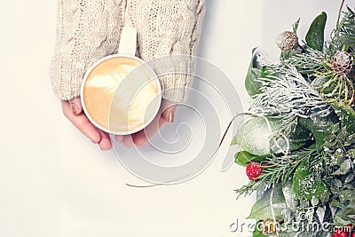 Girl holding cup of coffee with latte art. Leasure time concept. Stock Photo