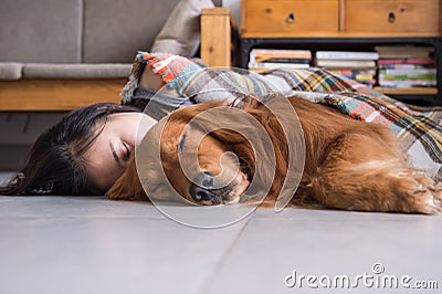 Girl holding the Golden Retriever to sleep Stock Photo