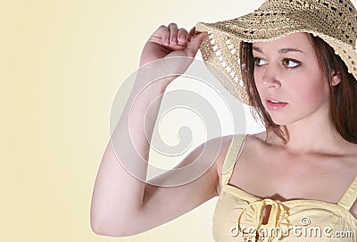 Girl holding hat brim Stock Photo