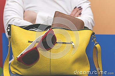 Girl holding her bag. Search for items in the bag. Stock Photo