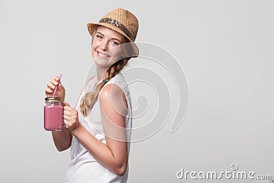 Girl holding jar tumbler mug with pink smoothie Stock Photo