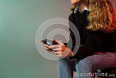 Girl holding joystick and play virtual game Stock Photo