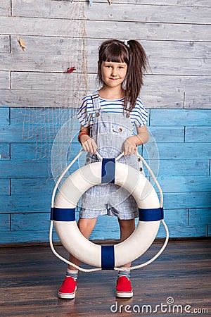 Girl holding a life preserver Stock Photo