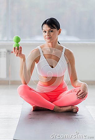 A girl holding a massage ball in her hands Stock Photo