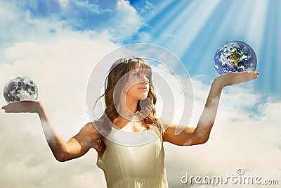 Girl holding moon and earth Stock Photo