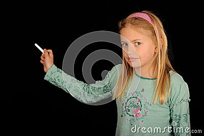 Girl holding piece of chalk Stock Photo