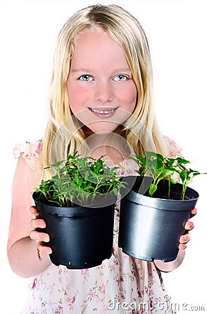 Girl Holding Plants Stock Photo