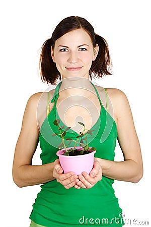 Girl holding potted plant and smiling Stock Photo