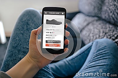 Girl holding smart phone with online shop concept on screen Stock Photo