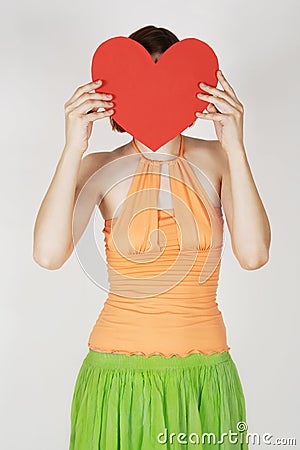 Girl holding valentine heart card Stock Photo