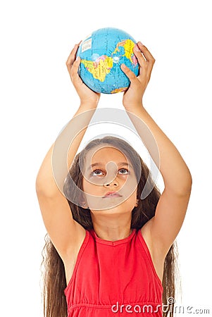 Girl holding world globe over head Stock Photo