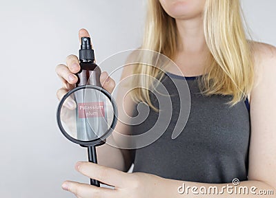 Girl holds in her hands three eco-friendly antiperspirants with natural ingredients. Refusal of antiperspirants containing toxic Stock Photo