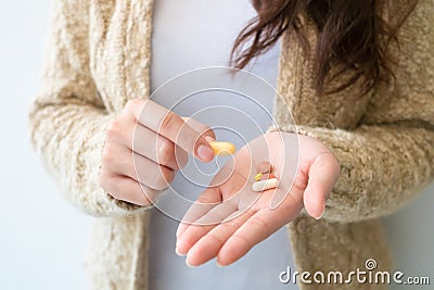 The girl holds the medicine in hand. Medical and health concepts Stock Photo