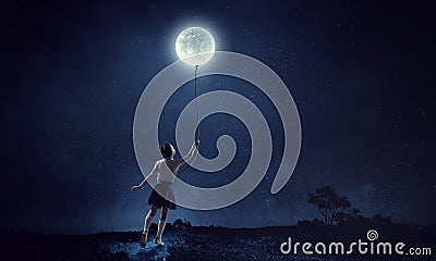 Girl holds the moon . Mixed media Stock Photo