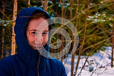 Girl in the hood in winter Stock Photo