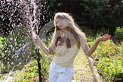 Girl with hose Stock Photo