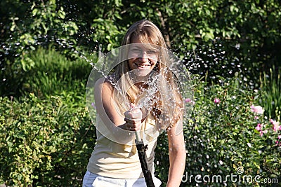 Girl with hose Stock Photo