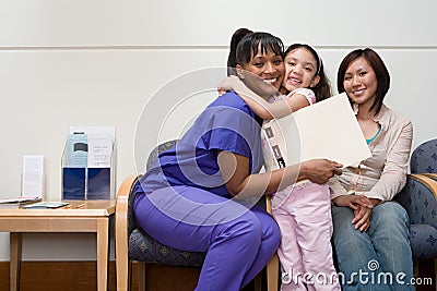 Girl hugging nurse Stock Photo