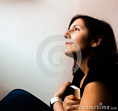 Girl imagining about the book Stock Photo