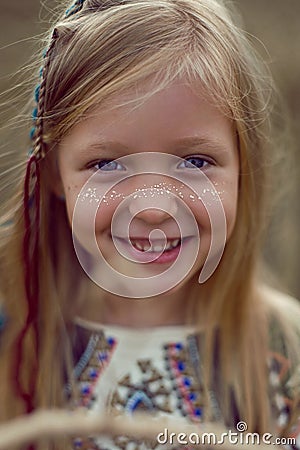 Girl Indian shaman blonde in a poncho Stock Photo