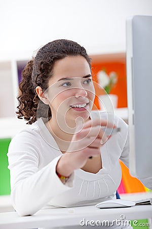 Girl inserting usb flash memory into computer Stock Photo