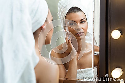 Girl inspecting her skin Stock Photo