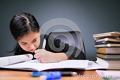 Girl intend to do homework Stock Photo