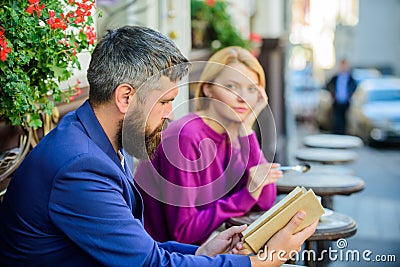 Girl interested what he reading. Literature common interest. How to find girlfriend with common interest. Guide to Stock Photo