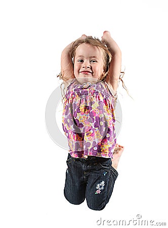 Girl jumping for joy Stock Photo