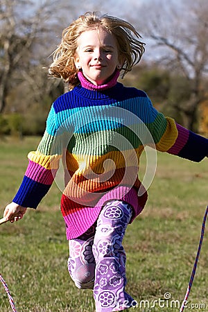 Girl jumping rope Stock Photo