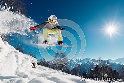 Girl is jumping with snowboard Stock Photo