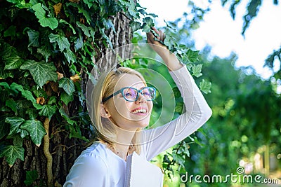 Girl keen on book keep reading. Woman blonde take break relaxing in park reading book. Lady cheerful laugh she likes Stock Photo