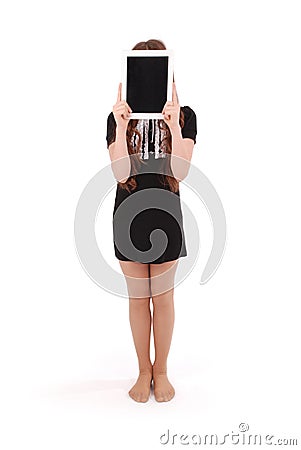 Girl keeps tablet pc in front of face Stock Photo