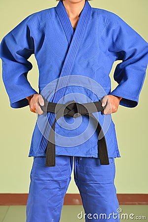 A girl in blue judo gi. Stock Photo