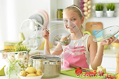 Girl on the kitchen cook Stock Photo