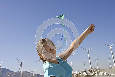 Girl With A Kite At Windmill Farm Stock Photo