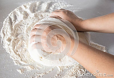 Closeup of girl kneads dough Stock Photo