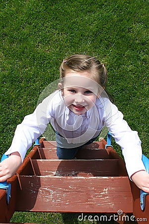 Girl on Ladder Stock Photo