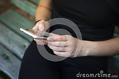 Girl leafing through a social network. Photo. Stock Photo