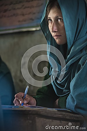 Girl learning in the only school in the village of Shimshal 3100m is a government school taught by teachers based in the village Editorial Stock Photo